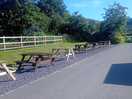Picnics benches opposite a food van so you can eat outside.
