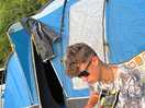 My son using his guitar while we were camping.