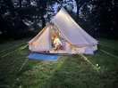 Bell tent all lit up at night
