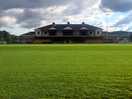 View across pitch to the stands with the facilities..