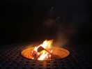 Roaring fire in the fire pit table