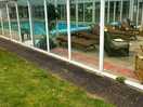 Swimming pool and cconservatory with magazines and games