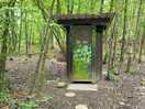 Compost toilet with the urinal behind the hut