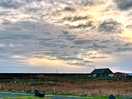 Sun setting over the site