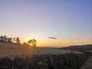 View of the sunset over the sea from our pitch