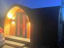 Night time view of camping pod.