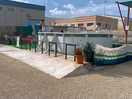 Above ground pool. note the industrial park in the background.