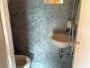 Toilet / shower . very clean , little soap and a toilet roll left for us . powerful hot shower