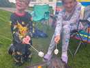 Toasting marshmallows on the fire