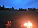 Campsite at night showing firepit