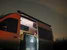 Night sky with the camper van and fire pit