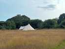 Glamping, at the other end of field/meadow