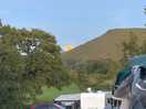 Moon peaking over the hills