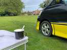 Small camper van on a spacious camp site at the green man long itchington