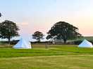 Campsite field with bell tents avail