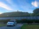 Van on the pitch, views of the tor in the background