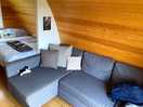 Inside pod, sofa turns into a double bed.