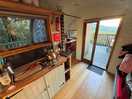 Kitchen area and seat which turns into a double bed