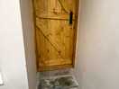 Door from bathroom two steps down into bathroom