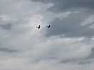 Spitfire and hurricane during a flyover at raf coningsby