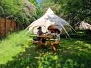 Our tent with dinning area outside with fire pit and bbq