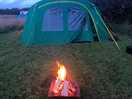 The fire in front of the tent.