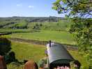 View across the valley from the beer garden of the pub, showing the shepherds hut below.