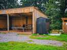 Big sheltered area with seating and a table tennis table should the weather turn