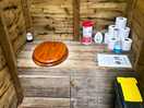 Eco toilet, clean with disinfectant wipes, emptied regularly, no smell or mess
