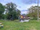 View of the pond and sauna from the campervan spots.