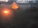 Tent, fire and hit tub in the evening