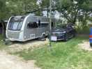 Car and caravan on pitch