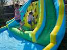 Swimming pool or bouncy castle is out in warm weather