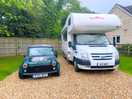 Large pitch fitted large motorhome trailer and mini on