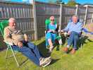 Friends, enjoying the sunshine, whilst sitting outside our camper van, on the pub site.