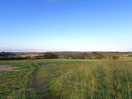 Walking along the country roads via the dirt path from the site