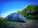 Tent, blue skies & trees