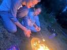 Kids enjoying the fire roasting marshmallows