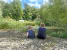 Kids enjoying one of the secluded areas that has crayfish.