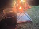 Adults next to the fire