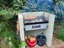 Bbq set next to the pod.
