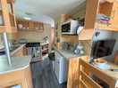 The kitchen contains everything necessary for an avwrage day of cooking and/or baking