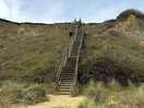 Stairs from the beach to the site