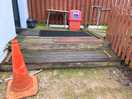 Steps up on decking to entrance of toilet/shower block