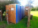 Two portaloo toilets and one shower facility.