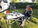My husband enjoying supper in the evening. a bit chilly but spacious and private pitch.