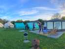 Kestrel yurt with cooking tent and bathroom on the right, other 2 glamping tents on the left.
