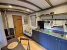 Interior of shepherds hut with woodburner