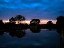 Night falls over the lake.