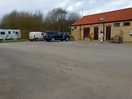 Shop/reception/ttoilets. to the far side, waste bins and locked family bathroom/family showers